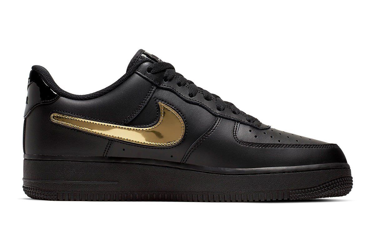 black nike with gold check