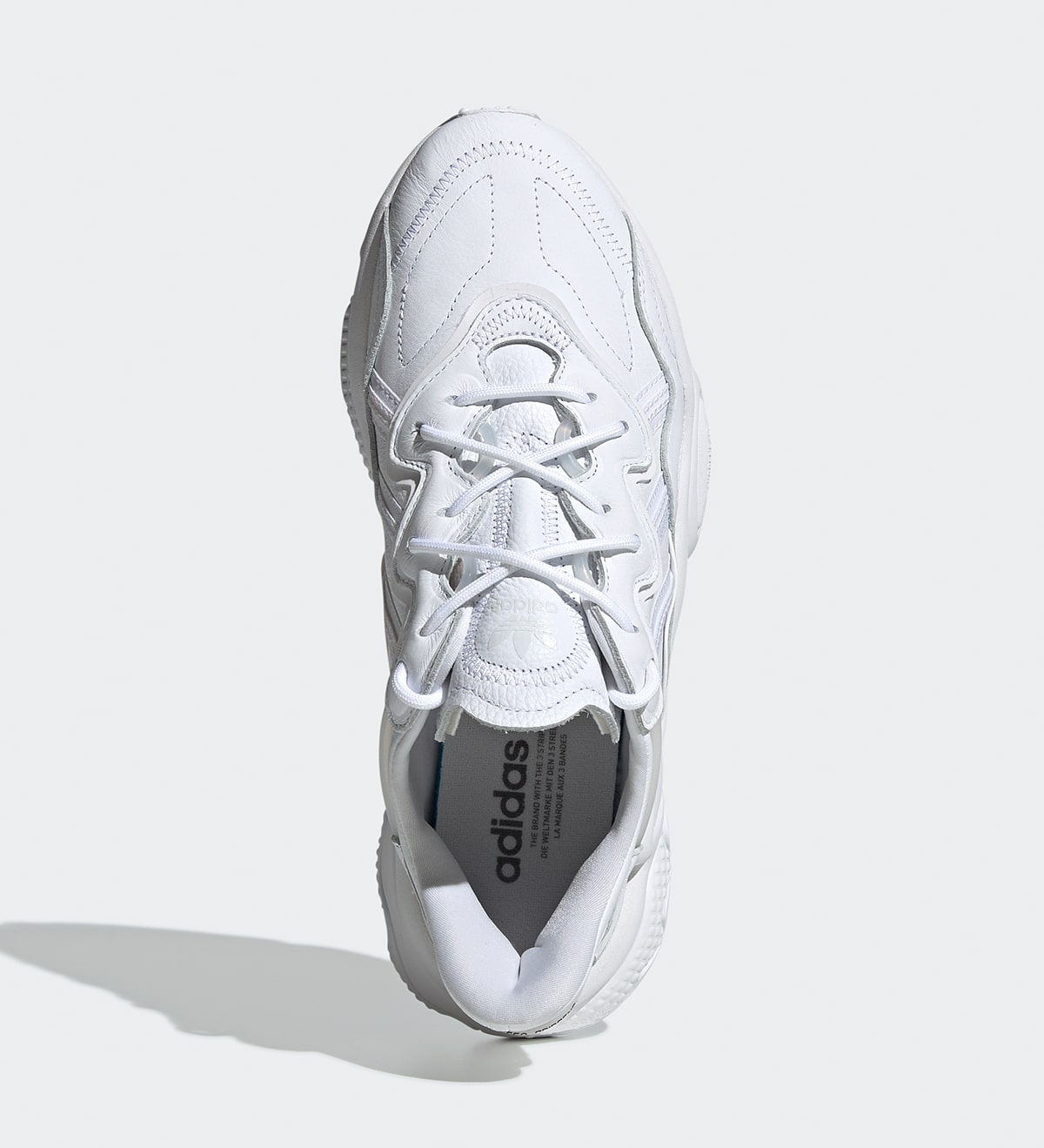 adidas originals ozweego sneakers in triple white