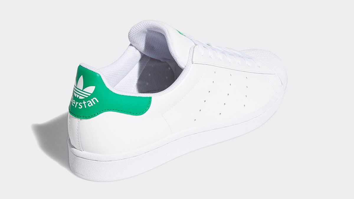 white adidas with green back