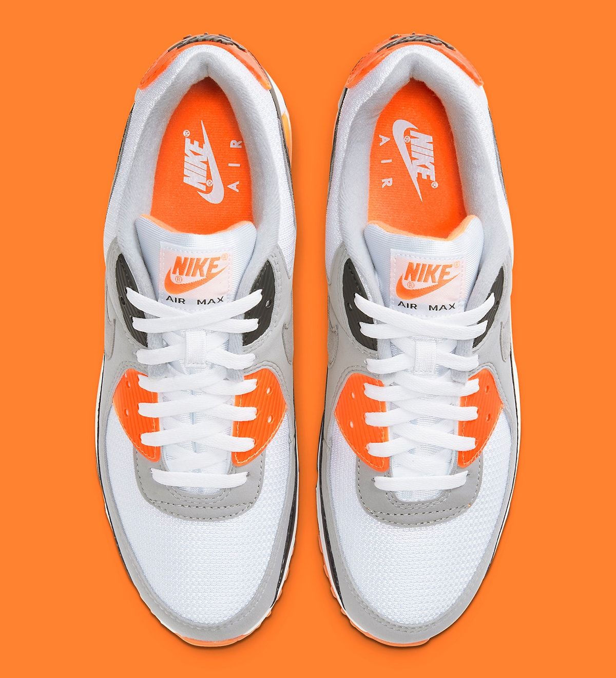 white and orange air max 90