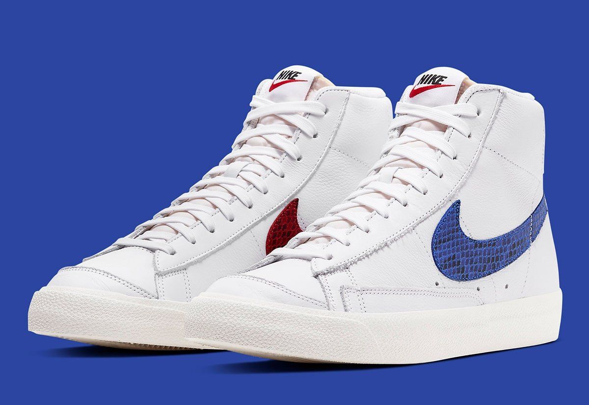 white nikes with red and blue swoosh