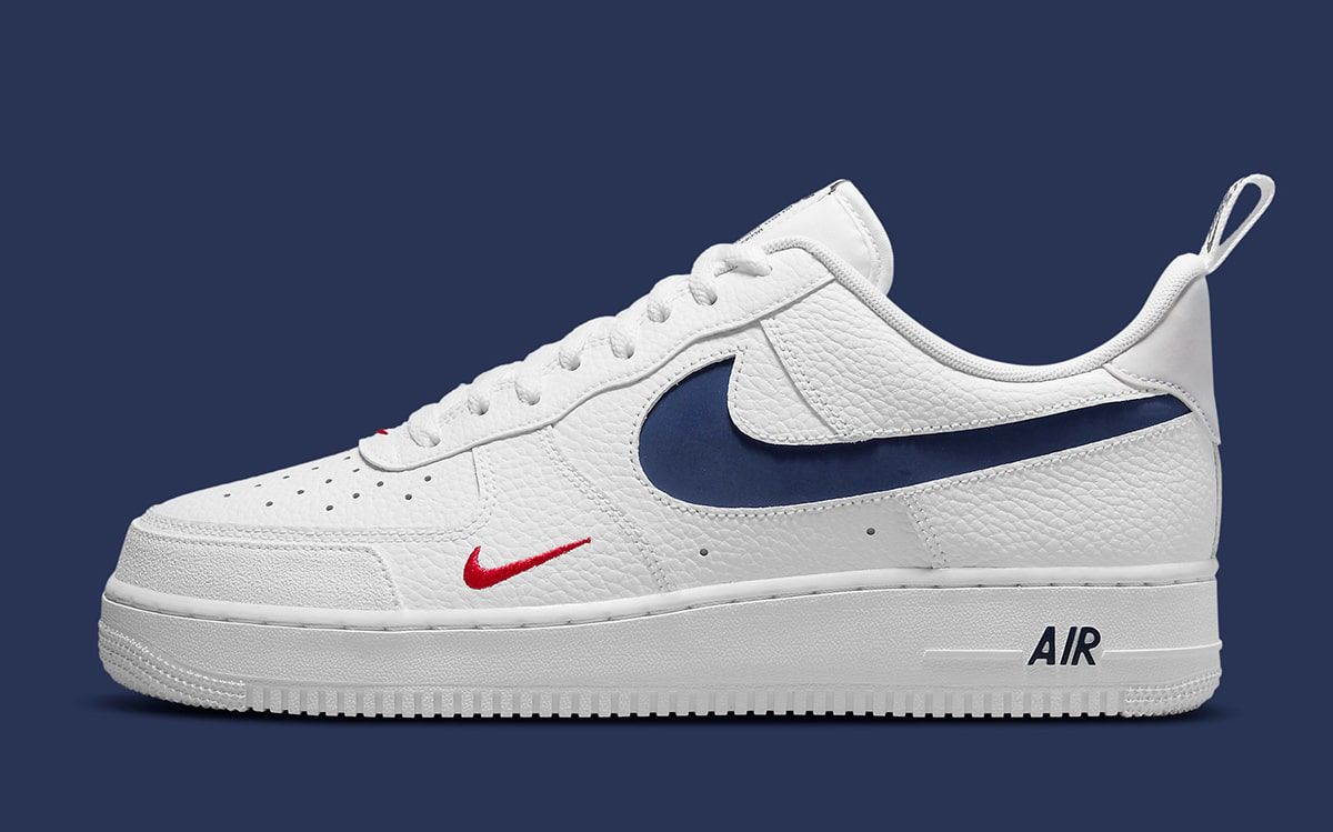 white and navy blue air forces